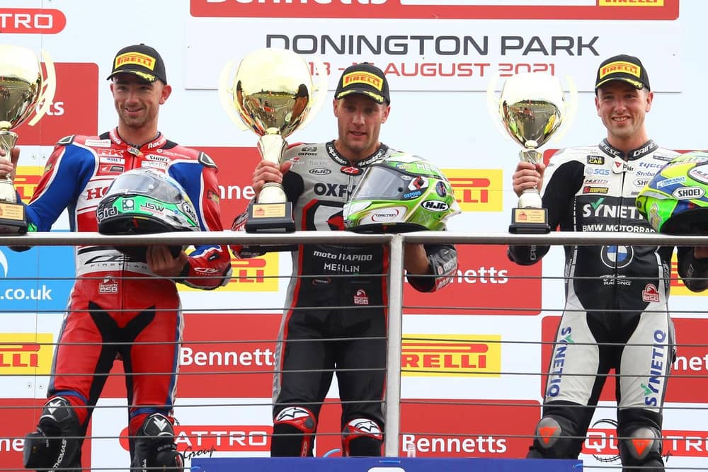 Glenn Irwin (left) finished as the runner-up in race three at Donington Park with brother Andrew (right) in third. They are joined on the rostrum by race winner Tommy Bridewell.