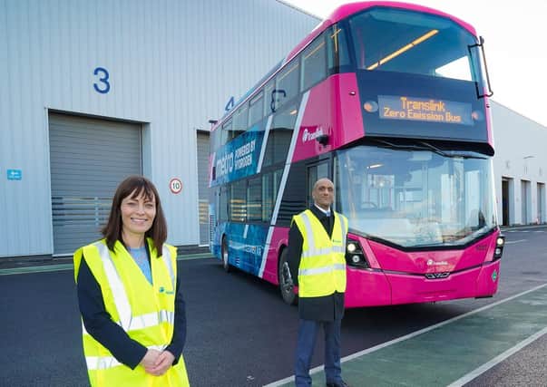 Infrastructure Minister Nichola Mallon with Buta Atwal from Wrightbus and one of the green buses