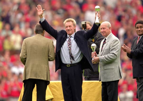 20 Aug 2000:  Manchester United legends (L to R) George Best, Denis Law and Bobby Charlton receive lifetime achievement awards from Eusebio as part of the National Footbal Awards during halftime in the FA Carling Premiership match against Newcastle United at Old Trafford in Manchester, England.  \ Mandatory Credit: Gary M Prior/Allsport
