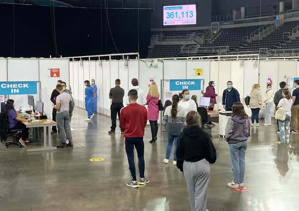 Queues for Covid-19 vaccines at the vaccine centre in the SSE Arena. Photo: Rebecca Black/PA Wire