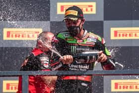 Jonathan Rea finished second in Sunday's Superpole race behind Scott Redding at Navarra in northern Spain.