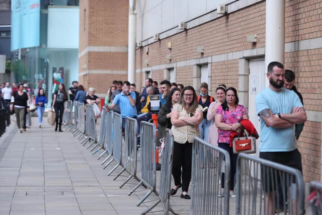 Long lines on Sunday forming outside a pop-up vaccine centre at The Quays shopping centre in Newry during the The Big Jab Weekend . Photo: Niall Carson/PA Wire