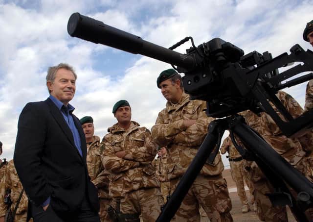 Tony Blair with British troops in Helmand, Afghanistan, in 2006. John Bruton says he was  altogether wrong to call the Joe Biden strategy "imbecilic"