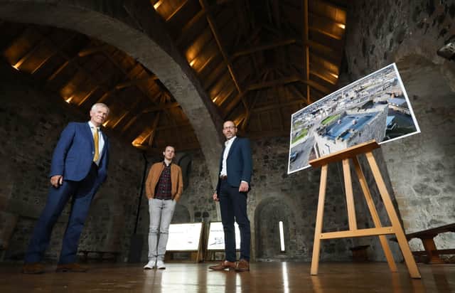 From left: Dermot MacRandal from the Department for Communities, Historic Environment Division, Andrew Bryce from Alastair Coey Architects and Ciaran Fox from RSUA celebrate winning an RSUA Design Award for the Carrickfergus Castle roof replacement project