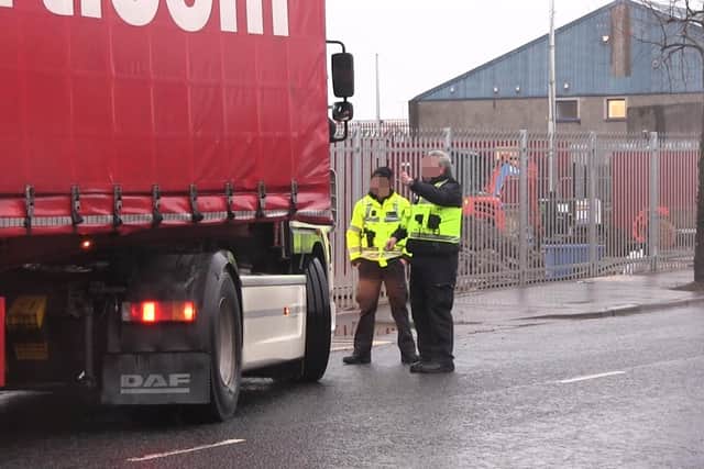 Border Force officers talk to a lorry driver at a checking facility near Belfast Port. The Irish Sea border is dismantling the Union before our eyes