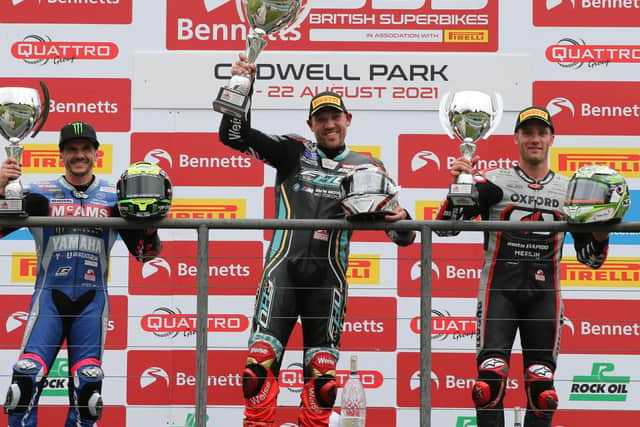 FHO Racing BMW rider Peter Hickman on the podium at Cadwell Park with race two runner-up Jason O'Halloran (left) and Tommy Bridewell, who finished third. Picture: David Yeomans Photography.
