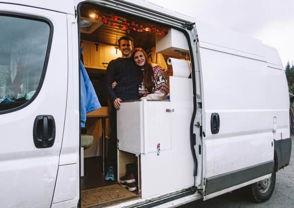 Bradley and Cazzy in their homemade campervan named 'Helen'