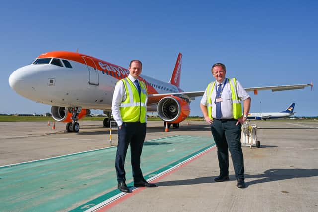 Economy  Minister Gordon Lyons with Graham Keddie, managing director of Belfast International Airport