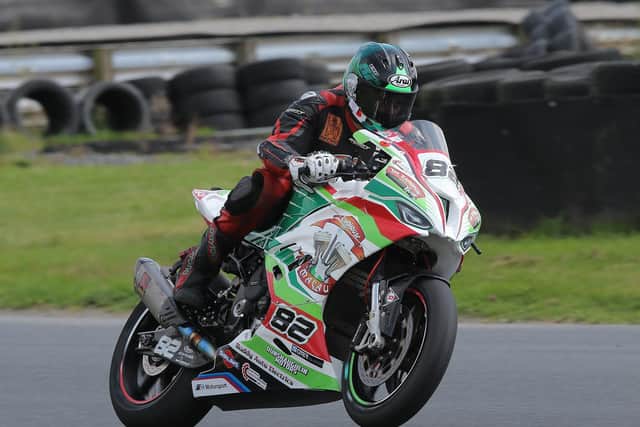 Derek Sheils took a victory in the Dunlop Masters Superbike Championship on the Roadhouse Macau BMW on Sunday at Mondello Park.