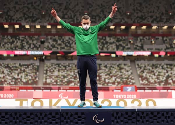 Gold medalist Jason Smyth of Team Ireland celebrates on the podium of Men's 100m - T13 Final on day 5 of the Tokyo 2020 Paralympic Games at Olympic Stadium on August 29, 2021 in Tokyo, Japan.