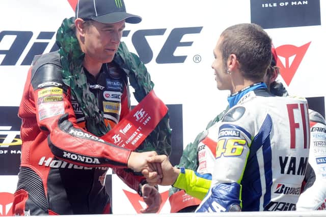 Valentino Rossi congratulates John McGuinness on winning the 2009 Superbike race at the Isle of Man TT.