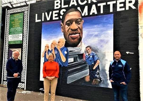 SF regional leader Michelle O'Neill and others at a mural honouring George Floyd in west Belfast