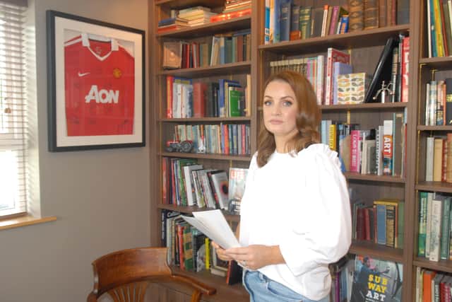 Louise Traynor recalls her experience of September 11 2001, speaking from her sister's house in south Armagh, ad coincidentally in front of an image of a sporting top sponsored by AON, the company that employed her in the twin towers of the World Trade Center in New York, and which she says treated her well