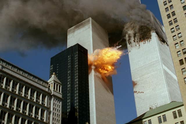 The South Tower of the World Trade Center in New York explodes just after Louise Traynor left the complex on the easterly side, towards Church Street, the side from which this picture was taken. She had only just looked back and for the first time seen smoke pouring from the North Tower, right