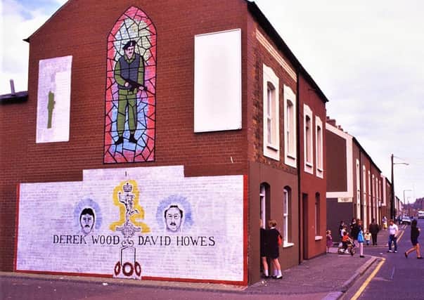 WALL MURAL IN EAST BELFAST IN MEMORY OF DEREK WOOD AND DAVID HOWES, KILLED AT AN IRA FUNERAL IN WEST BELFAST