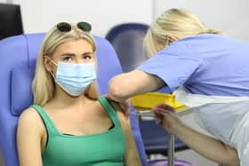 17-year-old Danielle McIlroy, from Bangor, is given the last vaccination of the day during the The Big Jab Weekend at the vaccine clinic at the SSE Arena, Belfast.