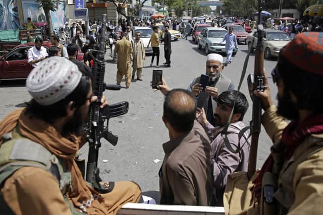 Taliban fighters in Kabul following the fal of the Afghan capital. (AP Photo/Rahmat Gul)
