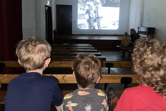 Early slapstick cinema has Johnny’s son and other young relatives rapt