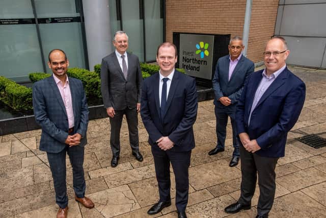 Economy Minister Gordon Lyons with Thomas Raju, Belfast Site Lead, Agio, Kevin Holland, CEO, Invest NI, Ray Hillen, managing director, Cybersecurity, Agio and Garvin McKee, chief Revenue Officer, Agio