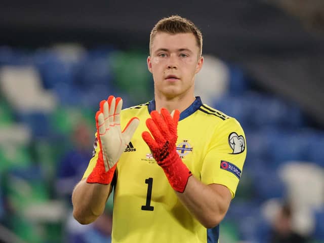 Northern Ireland’s Bailey Peacock-Farrell salutes the fans last night in Windsor Park after his penalty save helped to secure a scoreless draw with Switzerland. Pic by Pacemaker.