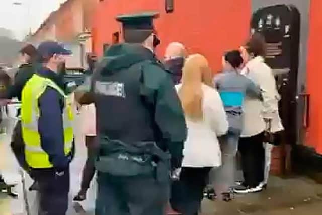 Police arrested a victim of a Troubles shooting on suspicion of disorderly behaviour after a memorial marking the 29th anniversary of a loyalist massacre at the Sean Graham's bookmakers shop in Belfast.
