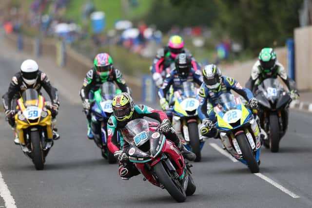 Adam McLean (McAdoo Kawasaki) leads the Supersport pack at the Cookstown 100 in 2020.