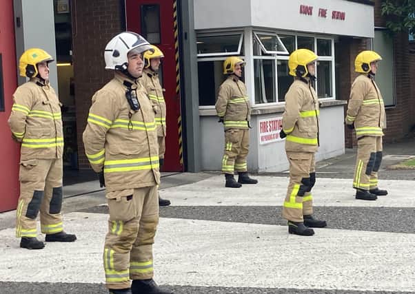 Firefighters at Knock Station in east Belfast stand for a minute silence to mark the 20th anniversary of the September 11 terrorist attack by al Qaida in the United States. Picture date: Saturday September 11, 2021.