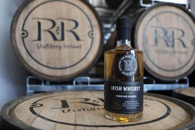 Backyard Whiskey is distilled from carefully fermented grains aged in wooden casket