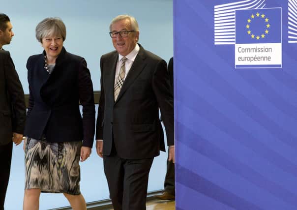 Theresa May with European Commission President Jean-Claude Juncker in Brussels on Dec 4 2017, the day Lord Caine first saw her Northern Ireland backstop plan — while the then prime minister was on the train to Belgium to finalise it