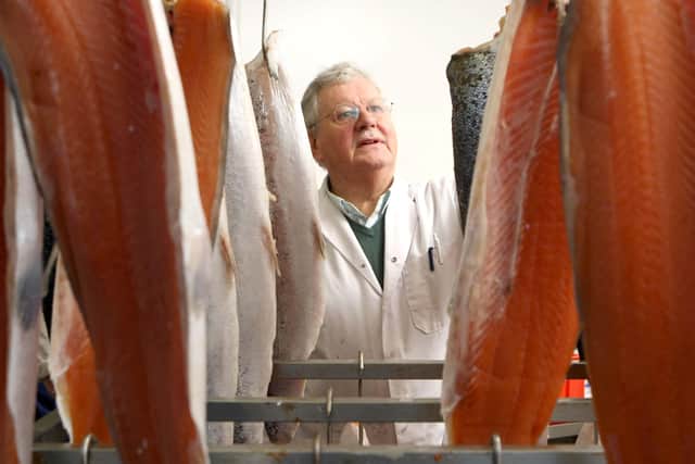 Walter Ewing checking salmon being smoked slowly in the company’s unique smokery on the Shankill Road in Belfast