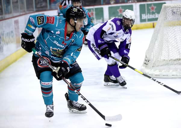 Belfast Giants' David Goodwin with Glasgow Clan's Liam Stenton during an Elite Ice Hockey League game at the SSE Arena, Belfast. Picture: William Cherry/Presseye
