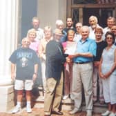 The Ulster Scots group in Knoxville pictured on September 11 2001. In the middle in a blue shirt holding the document is the late Lord Laird, his wife Carol to the right of him. Above them, the bearded man is George Holmes, who was culture director at Ulster Scots Agency. Billy Kennedy is partly obscured behind the man in the hat, his wife Sally is in white trousers immediately to the left of the man with hat. Sally died on Thursday