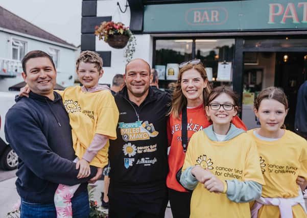 Rory Best arrives into Cong, Co. Mayo having successfully completed his 180 mile walk from Newcastle Co. Down. He is accompanied by Penny O'Brien (6), her parents Kevin and Sinead and sisters Emma and Abigail who have benefited from Cancer Fund for Children support.