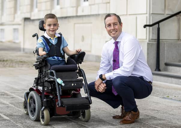 Northern Ireland First Minister Paul Givan with Reuben Walls (8) after a tour of Parliament Buildings at Stormont in Belfast. Picture date: Monday September 20, 2021.