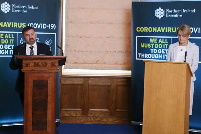 Health Minister Robin Swann (left) and Cathy Jack, Belfast Trust Chief Executive, during a Coronavirus media briefing at Parliament Buildings, Stormont, Belfast