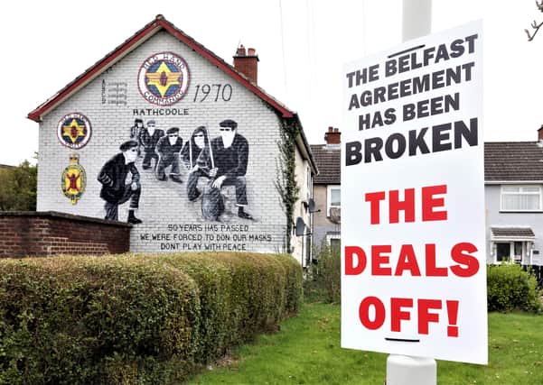 A sign claiming the Belfast (Good Friday) Agreement has been broken by the Northern Ireland protocol in Britain's Brexit deal has been erected beside a mural of masked members of the loyalist paramilitary group, the Red Hand Commandos in the Rathcoole estate, Newtownabbey, Co Antrim. 
The legend on the mural reads 'Don't play with peace.'
PICTURE BY STEPHEN DAVISON