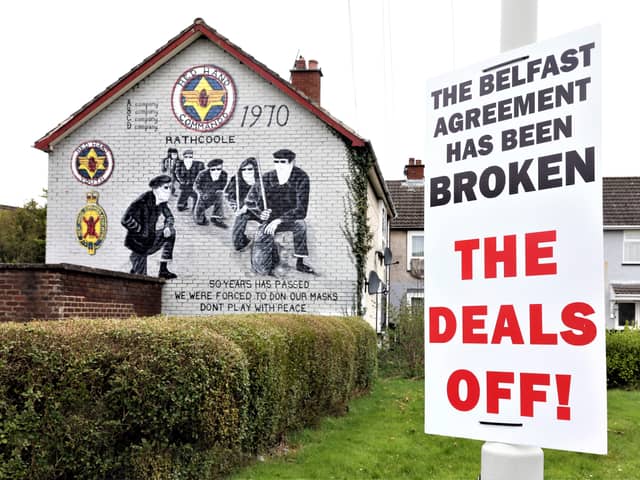 A sign claiming the Belfast (Good Friday) Agreement has been broken by the Northern Ireland protocol in Britain's Brexit deal has been erected beside a mural of masked members of the loyalist paramilitary group, the Red Hand Commandos in the Rathcoole estate, Newtownabbey, Co Antrim. 
The legend on the mural reads 'Don't play with peace.'
PICTURE BY STEPHEN DAVISON