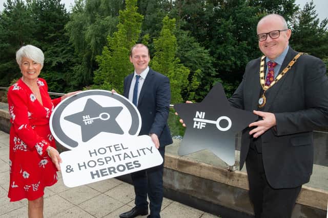 Pamela Ballantine, Economy Minister Gordon Lyons MLA and Stephen Meldrum, NIHF president and general manager of Grand Central Hotel