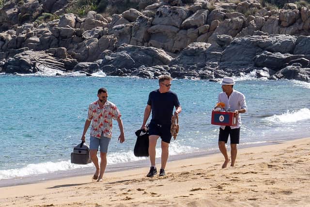 Gordon Ramsay Gino D'Acampo and Fred Sirieix taste test the Mykonos sausage at a Barbecue on Paradise Beach