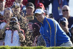 Team Europe's Rory McIlroy hits from a bunker on the second hole at the Ryder Cup. Pic by AP.