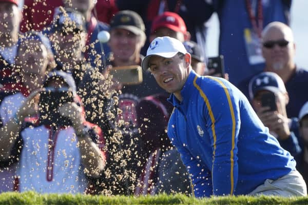 Team Europe's Rory McIlroy hits from a bunker on the second hole at the Ryder Cup. Pic by AP.