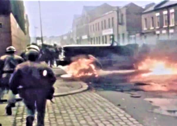 Soldiers pictured during a wave of bombings and arson in Belfast’s densely-packed city neighbourhoods around the time internment was launched in 1971