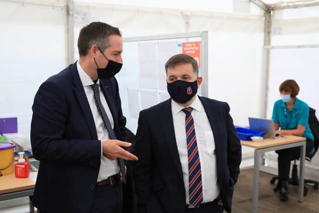 Northern Ireland First Minister Paul Givan, (left), and Minister for Health Robin Swann visit a Covid-19 Vaccination centre at the Balmoral show, Lisburn. The Balmoral show is Northern Ireland's largest agriculture and food event