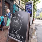 A sign welcoming people back to Harlem Cafe in Belfast City Centre. 

Picture by Jonathan Porter/PressEye