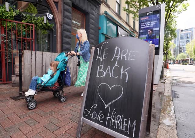 A sign welcoming people back to Harlem Cafe in Belfast City Centre. Picture by Jonathan Porter/PressEye