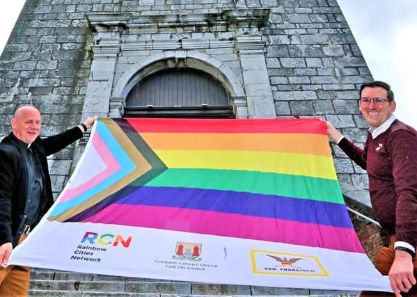 Rev Paul Robinson and activist Stephen Spillane with a modified rainbow flag at St Anne’s Church, Shandon, Cork, during the summer; the flag is used by those who feel the existing rainbow flag was not 'inclusive' enough, so the pale pink and blue stripes have been added to represent transgender people, and the brown and black ones to represent Black Lives Matter