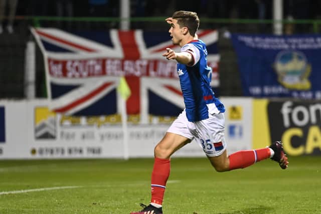 Cameron Palmer scores Linfield's third goal against Glentoran at The Oval.