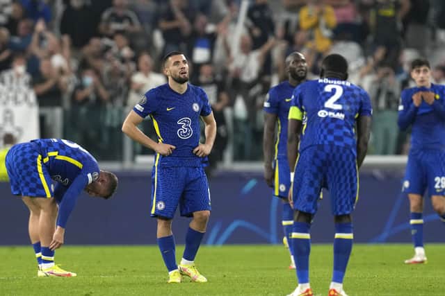 Chelsea players stand on the pitch in dejection at the end of the Champions League group H match between Juventus and Chelsea at the Allianz stadium in Turin, Italy. Pic by PA.