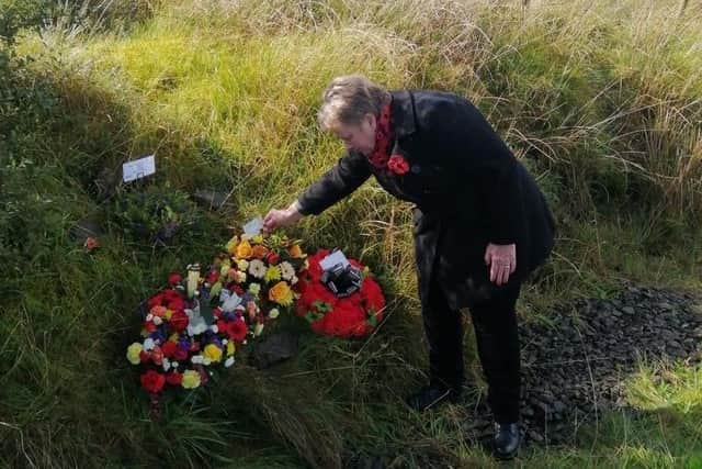 A family member one of five men killed by an IRA bomb, on Brougher mountain on Saturday 50 years ago as they travelled to repair a BBC transmitter. The families of the victims of an IRA bomb gathered there for the dedication of a new memorial. Photo: Kenny Donaldson/PA Wire