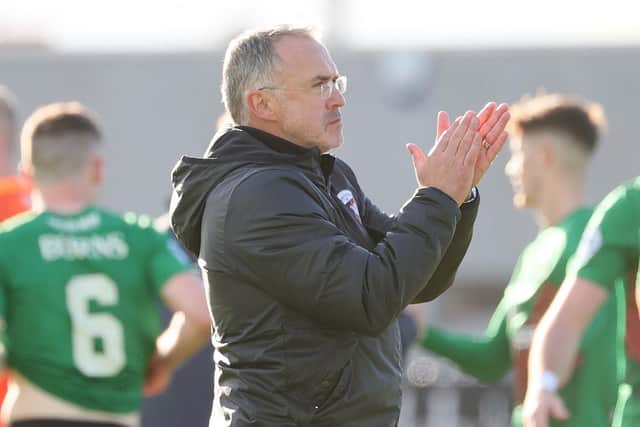 Glentoran manager Mick McDermott salutes the away supporters after defeat of Glenavon on Saturday. Pic by Pacemaker